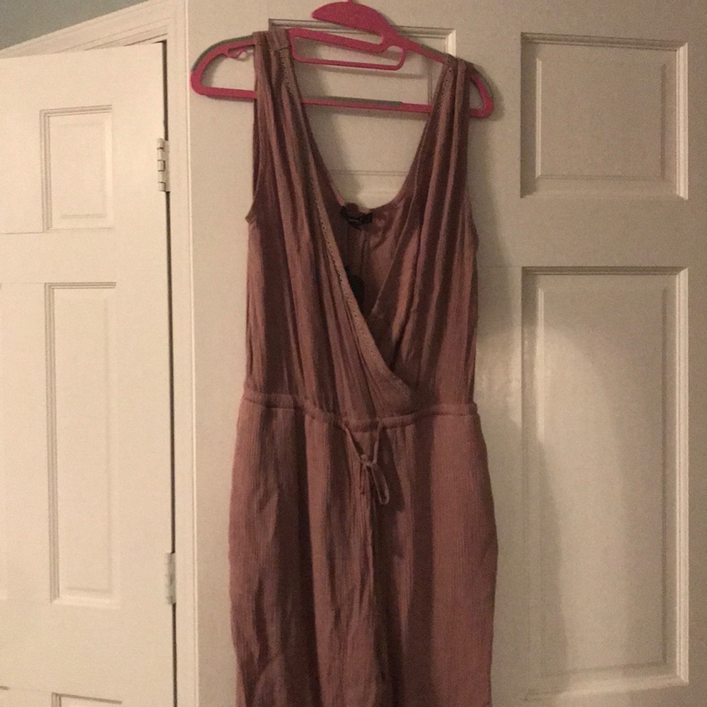 Never been worn ..One piece beige jumpsuit